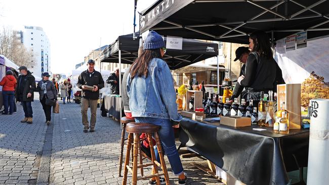 Stalls that offer tasting of alcohol had to provide stools for patrons to sit on due to the COVID-19 restrictions. Picture: Zak Simmonds