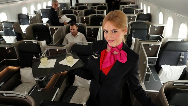 On Qantas’s longest flight, being in business class helps. Cabin crew on last year’s first non-stop flight from Perth to London. Pic: Colin Murty