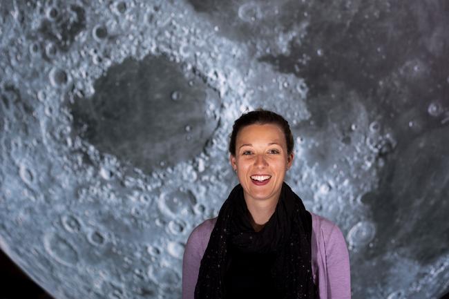 Curator Dr Sarah Reeves at the Powerhouse Museum, Sydney, with Luke Jerram's artwork, Museum of the Moon. Picture: supplied