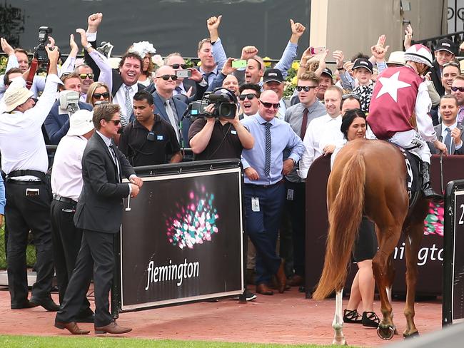 Owners rejoice as Mark Zahra and Palentino returns to the parade ring after winning the Group 1 Australian Guineas. Picture: Getty Images