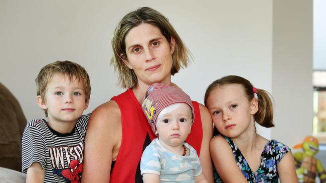 Brodie Donegan — pictured with her children Lachlan, 5, Nixon, 11 months and Ashlee, 8 — has lobbied successive governments for changes to the Crimes Act. Picture: Peter Clark