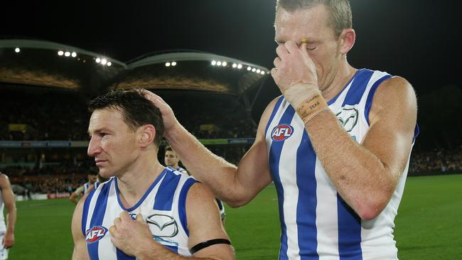 Brent Harvey and Drew Petrie walk off for the final time as North Melbourne players. Picture: Michael Klein