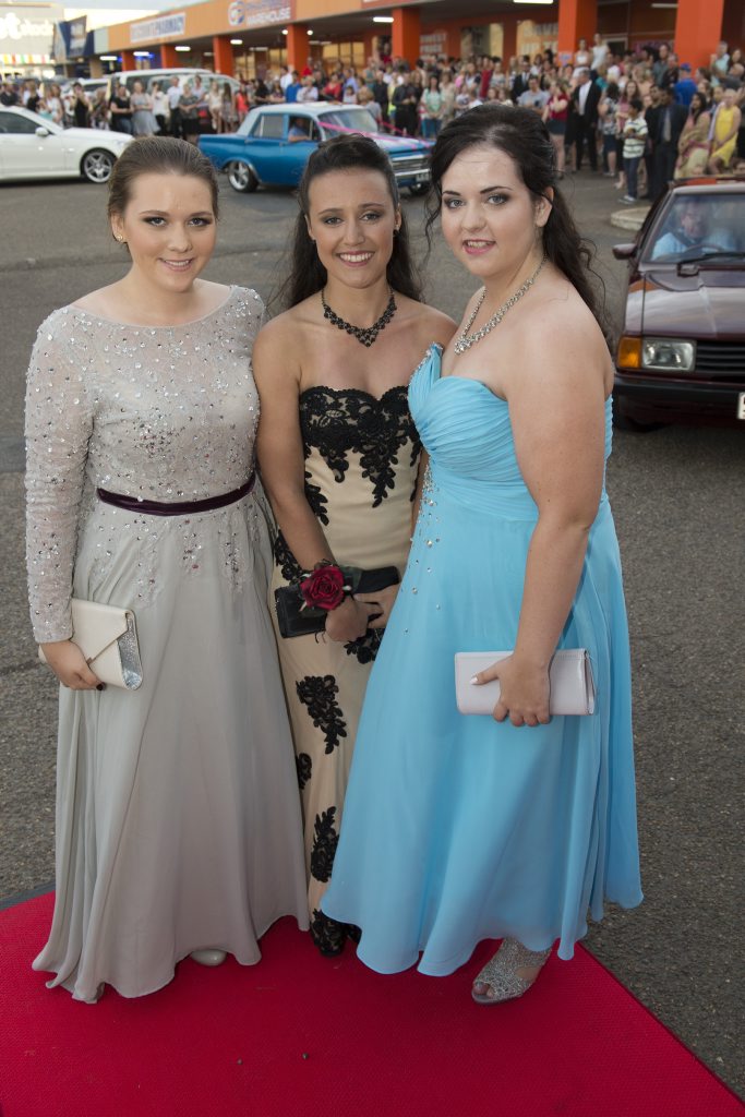 Arriving at their ball are (from left) Anastassia Laffin, Carrie Daley and Laura Wagner. Picture: Kevin Farmer