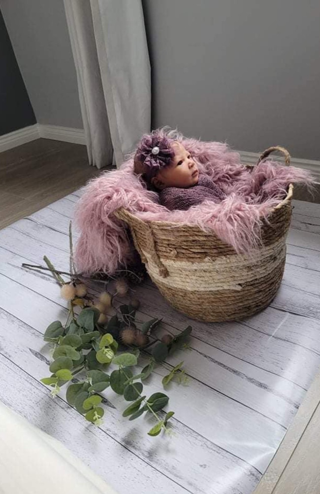 She spent $10 on the woven basket, the wooden grain adhesive vinyl was $3, the purple wrap, fur rug and headband was $25 from eBay and the faux flowers are from Target. Picture: Hannah Borja-Perez