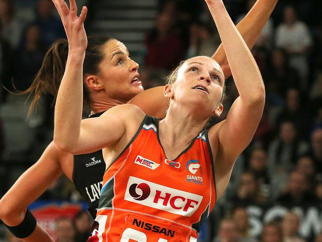Sharni Layton of the Magpies in action against Jo Harten of the Giants during the Round 13 Super Netball match between the Magpies Netball and the Giants Netball at Hisense Arena in Melbourne, Sunday, July 29, 2018. (AAP Image/George Salpigtidis) NO ARCHIVING, EDITORIAL USE ONLY