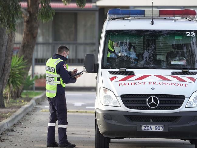 Residents are removed from St Basil's home for the aged in Fawkner, Melbourne on Friday 31st July.  Pic Stefan Postles