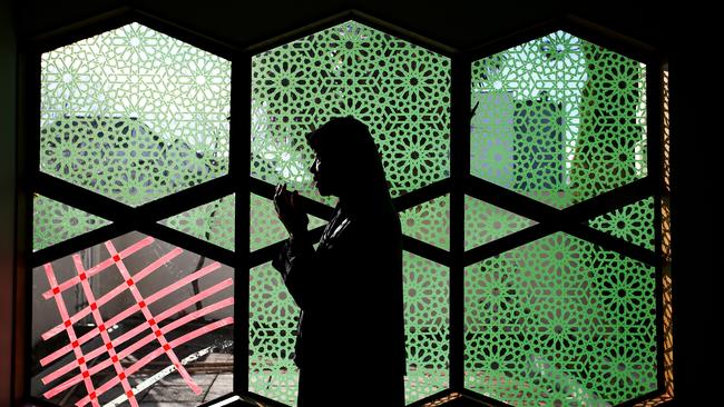 Jumayah Jones, a survivor of the Christchurch attack, prays at Al Noor Mosque. Picture: Getty Images