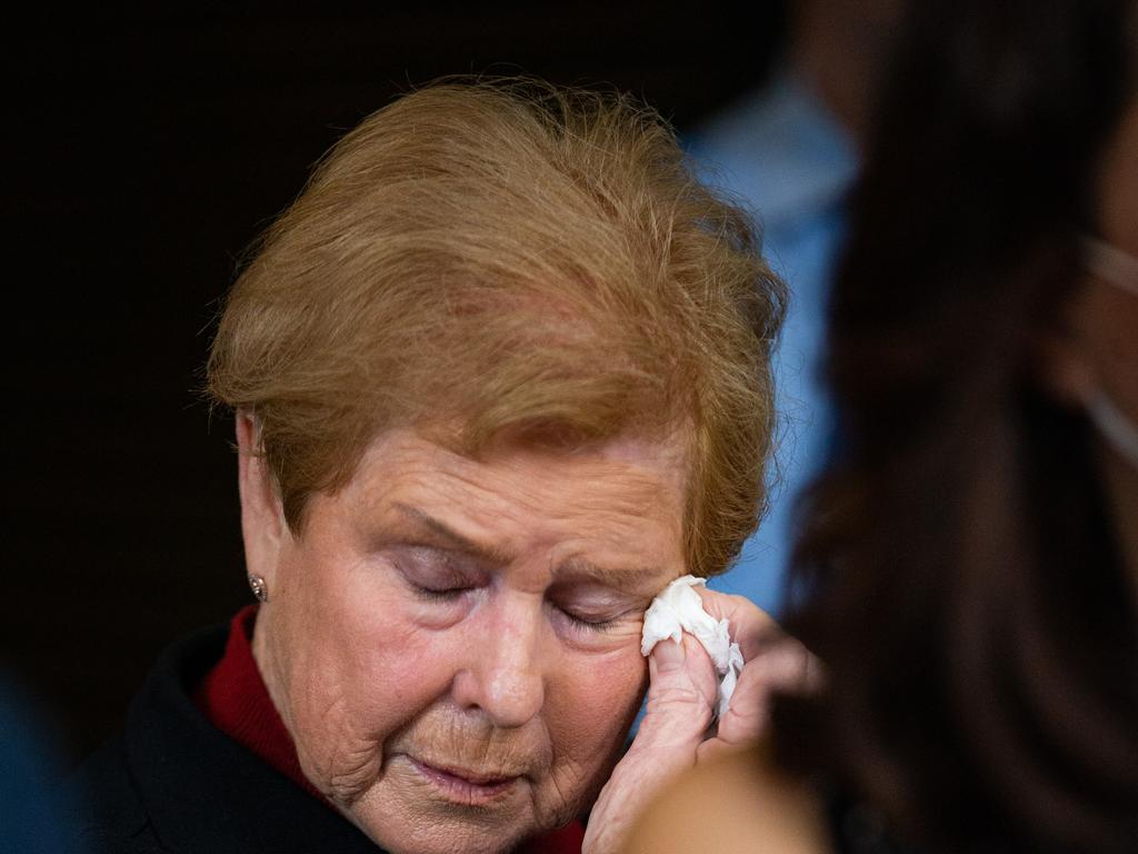 One of Jo Duke’s family members wipes away tears outside the Downing Centre. Picture: NCA NewsWire / Christian Gilles.