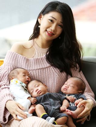 Olivia Cheung with her triplet sons Wintson, Ashton and Triton. Picture: Tim Hunter