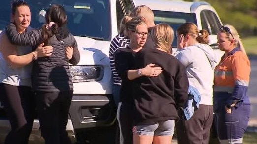 People gather at the scene of the fatal hit and run at Caboolture, north of Brisbane. Picture: 9 News