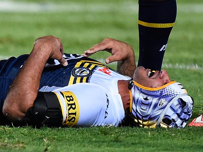 TOWNSVILLE, AUSTRALIA - MARCH 14: Johnathan Thurston of the Cowboys lays on the ground after being injured during the round two NRL match between the North Queensland Cowboys and the Newcastle Knights at 1300SMILES Stadium on March 14, 2015 in Townsville, Australia. (Photo by Ian Hitchcock/Getty Images)