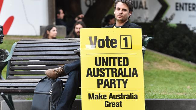 A United Australia Party campaigner outside the State Library in Melbourne. Picture: AAP