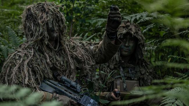 Australian Army soldiers Private Callum Atherton (left) and Private Alexander Raymond (right) from 8th/9th Battalion, Royal Australian Regiment's Reconnaissance, Surveillance and Sniper Platoon prepares to launch a Black Hornet Nano Unmanned Aerial System to assist in a reconnaissance task. Picture: Supplied