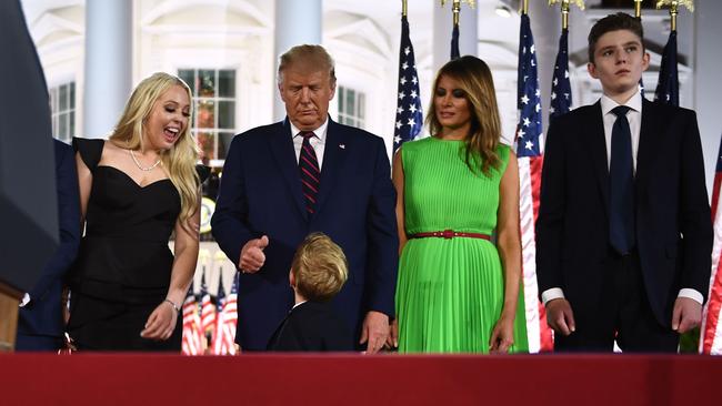 President Trump gives a thumbs up to grandson Theodore James Kushner as he stands next to First Lady Melania Trump, second right, and Barron Trump. Picture: AFP