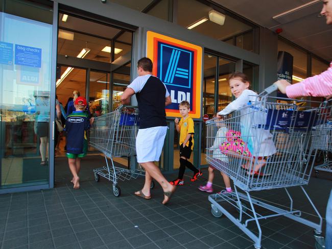 Keen shoppers line up outside Alid Supermarket in Kelvin Grove hoping to grab bargains at the annual ski sale.Photo: Claudia Baxter