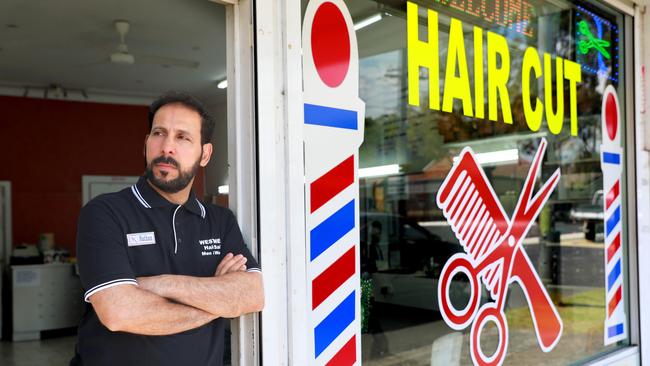 Barber Nathan Kadim at his barber shop. Picture: Angelo Velardo