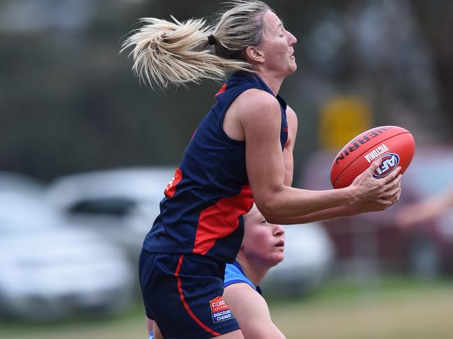 VFL (women's) football: Diamond Creek v VU Western Spurs at Plenty War Memorial Park, Plenty. Western Spurs in light blue jumpers.  No 4 for Diamond Creek Tanya Hetherington marks. Picture: Lawrence Pinder