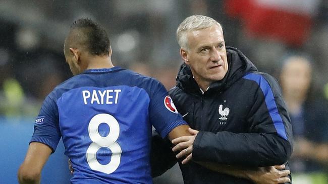 France's Dimitri Payet is hugged by France coach Didier Deschamps.