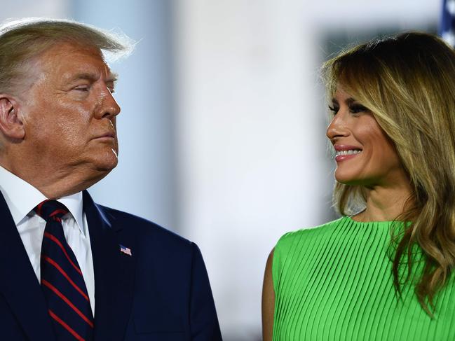 (FILES) In this file photo taken on August 27, 2020 US First Lady Melania Trump smiles at US President Donald Trump at the conclusion of the final day of the Republican National Convention from the South Lawn of the White House in Washington, DC. - Melania Trump on September 4, 2020 defended her husband against allegations that he referred to US Marines buried in a WWI cemetery in France as "losers" and "suckers." (Photo by Brendan Smialowski / AFP)