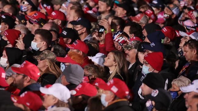 Supporters listen as Donald Trump at a campaign rally at the Southern Wisconsin Regional Airport in Janesville, Wisconsin, on Sunday. Picture: AFP