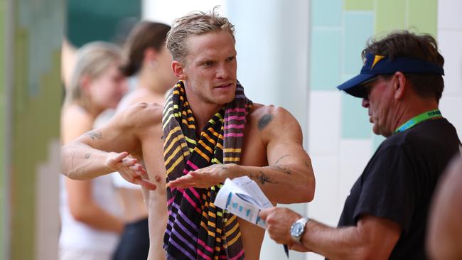 GOLD COAST, AUSTRALIA - APRIL 17: Cody Simpson speaks with coach Michael Bohl during the 2024 Australian Open Swimming Championships at Gold Coast Aquatic Centre on April 17, 2024 in Gold Coast, Australia. (Photo by Chris Hyde/Getty Images)