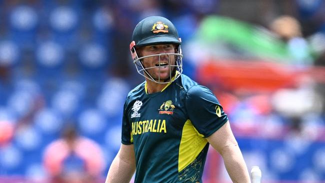 Australia's David Warner reacts after getting dismissed during the ICC men's Twenty20 World Cup 2024 Super Eight cricket match between Australia and India at Daren Sammy National Cricket Stadium in Gros Islet, Saint Lucia on June 24, 2024. (Photo by Chandan Khanna / AFP)