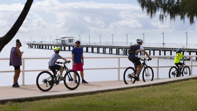 People exercising along the Sandgate foreshore. Picture: Renae Droop