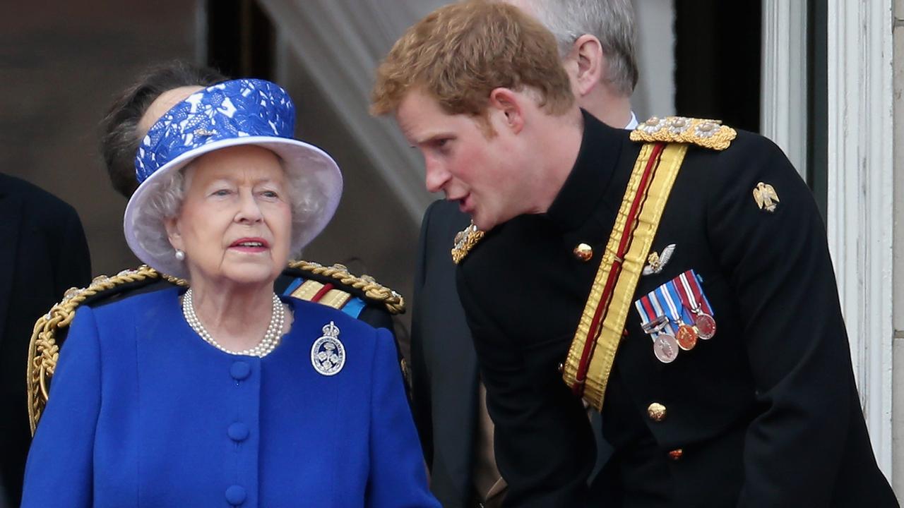 Prince Harry chats to Queen Elizabeth on the balcony of Buckingham Palace in 2013. Picture: Chris Jackson/Getty Images