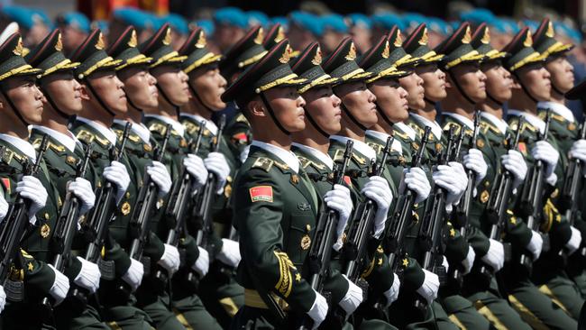 Soldiers from China's People's Liberation Army march in a military parade. Picture: AFP