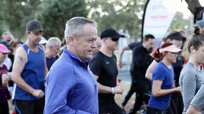 Bill Shorten takes part in a run in Melbourne. Picture: Liam Kidston