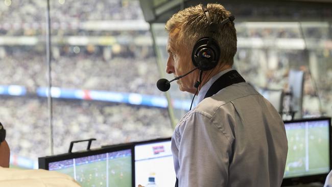 Bruce McAvaney at work in the commentary box.