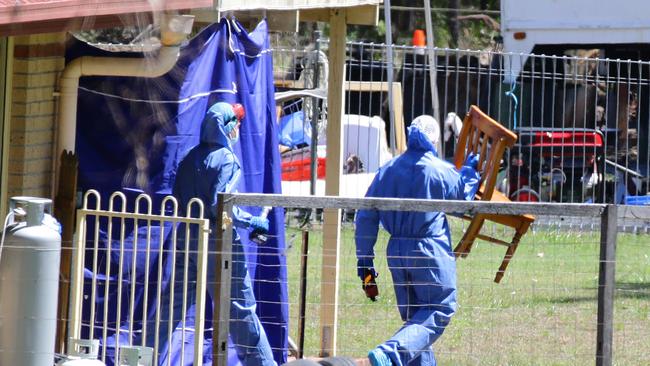 Police remove a chair at the home of Rick Thorburn, in regards to the murder of Tiahleigh Palmer. Pic Darren England.