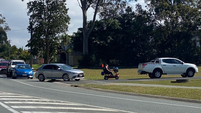 Cars waiting outside Caboolture Seventh Day Adventist Church.