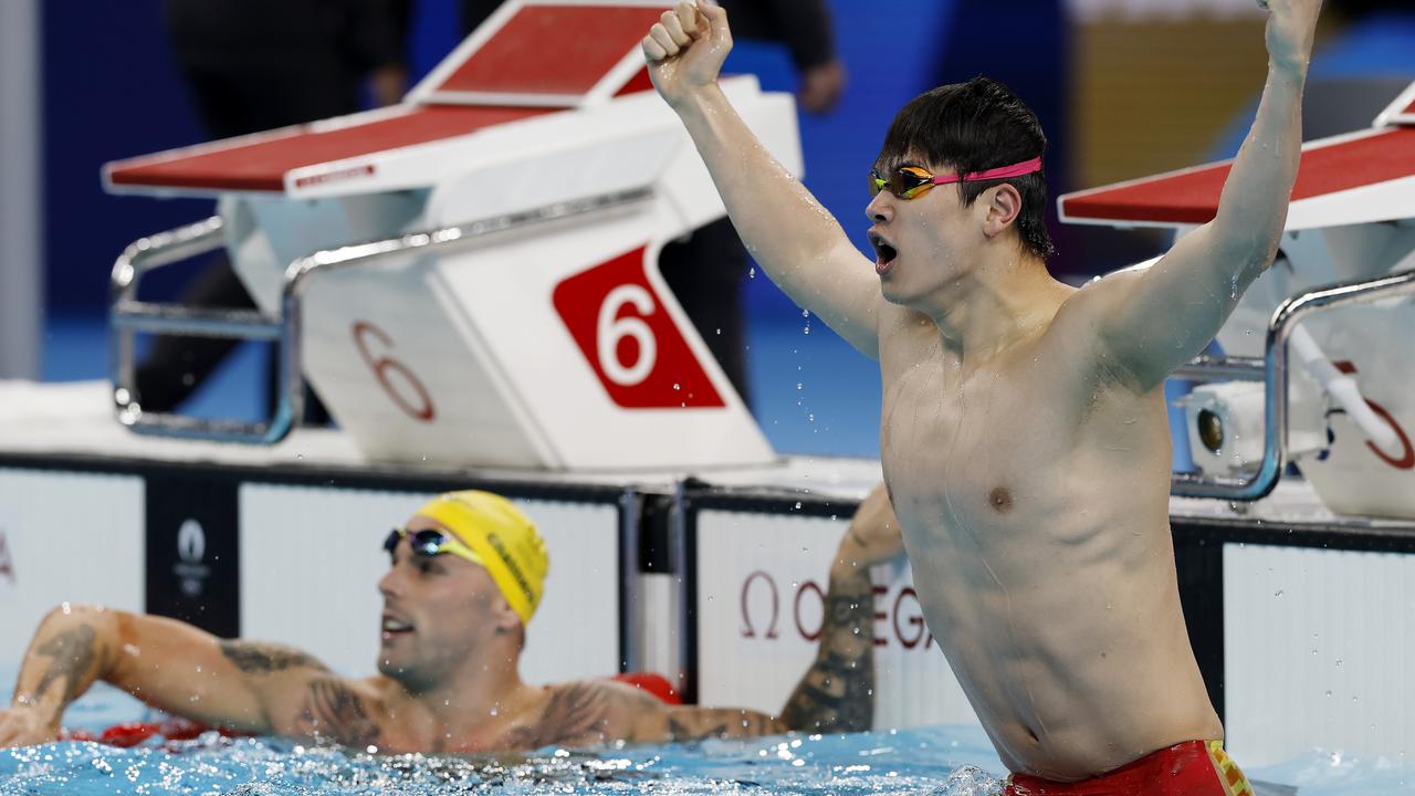 World record time: China’s gold medallist Zhanle Pan celebrates alongside Chalmers. Picture: Michael Klein