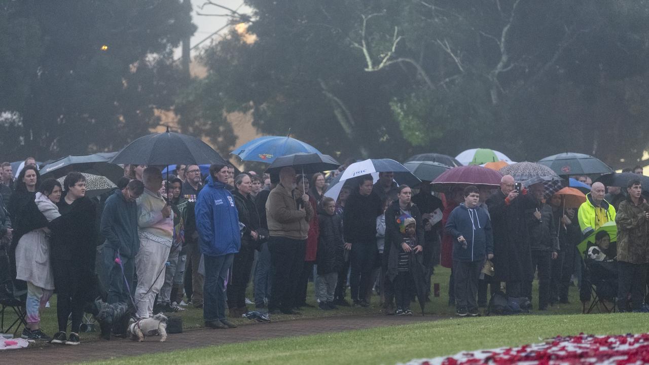 Rain failed to deter residents from paying their respects at the Mothers' Memorial for the Anzac Day Toowoomba Dawn Service, Tuesday, April 25, 2023. Picture: Kevin Farmer