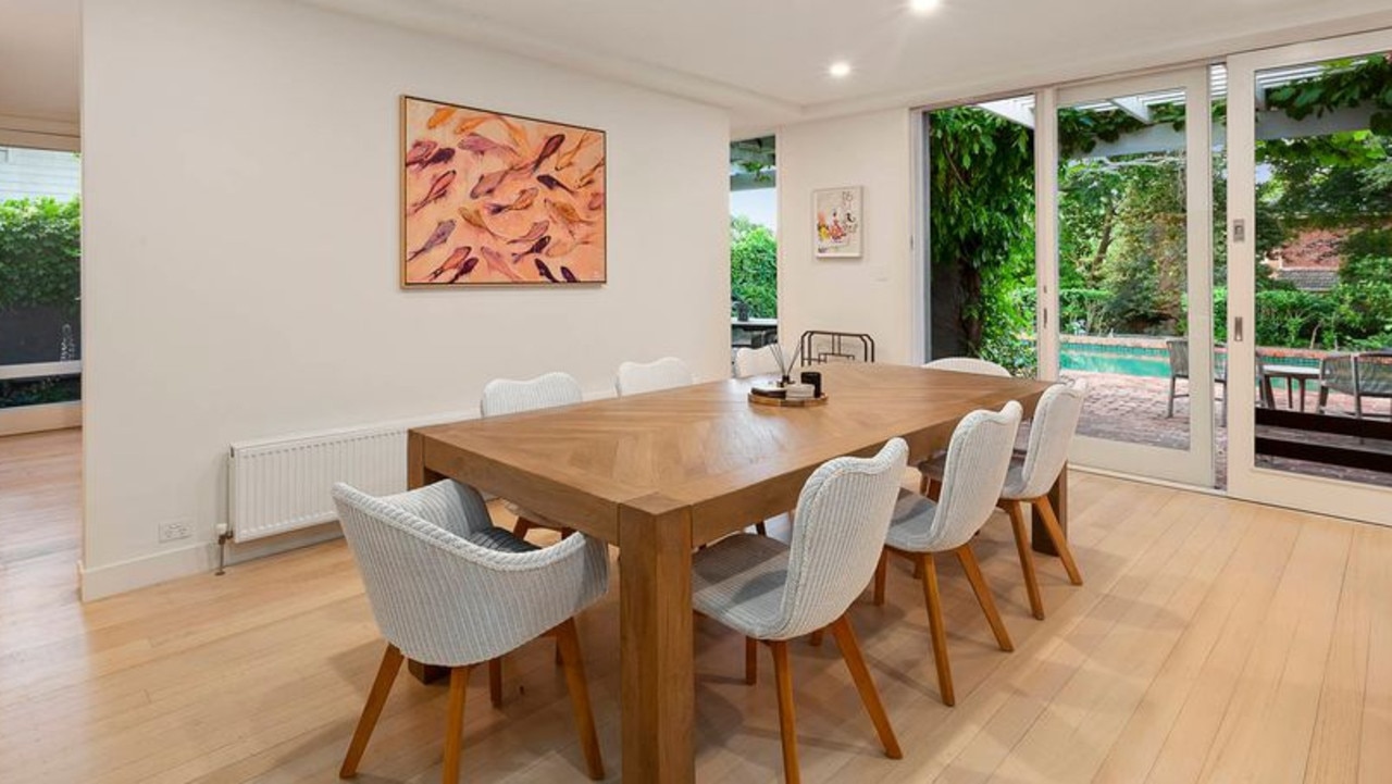 The main living areas of the home wrap around the north-facing pool view.