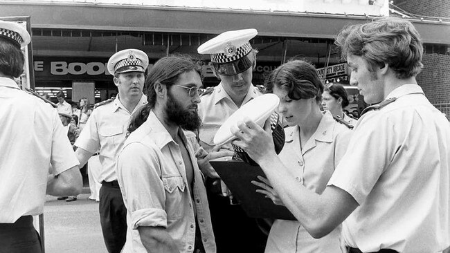 Former Queensland undercover police officer Keith Banks (pictured on right) in 1977 processing an arrest during a street march against the Bjelke-Petersen government's anti-march legislation.