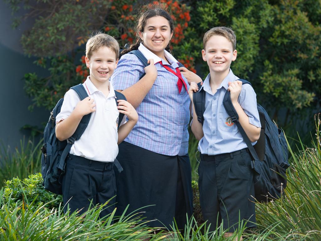 Cannon Hill Anglican College students Ethan, 6, and Ryan Nettleton, 9, with Jemimah Rego, 14