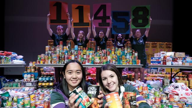 Centenary Heights State High School student council president Ria Biscocho and vice president Lily Pederick. Food donation to Lifeline Darling Downs.