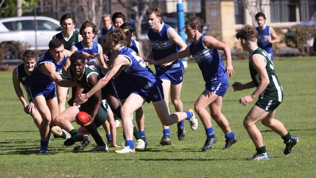 Westminster’s Antonio James under pressure, being tackled by Sacred Heart opponents. Picture: Russell Millard