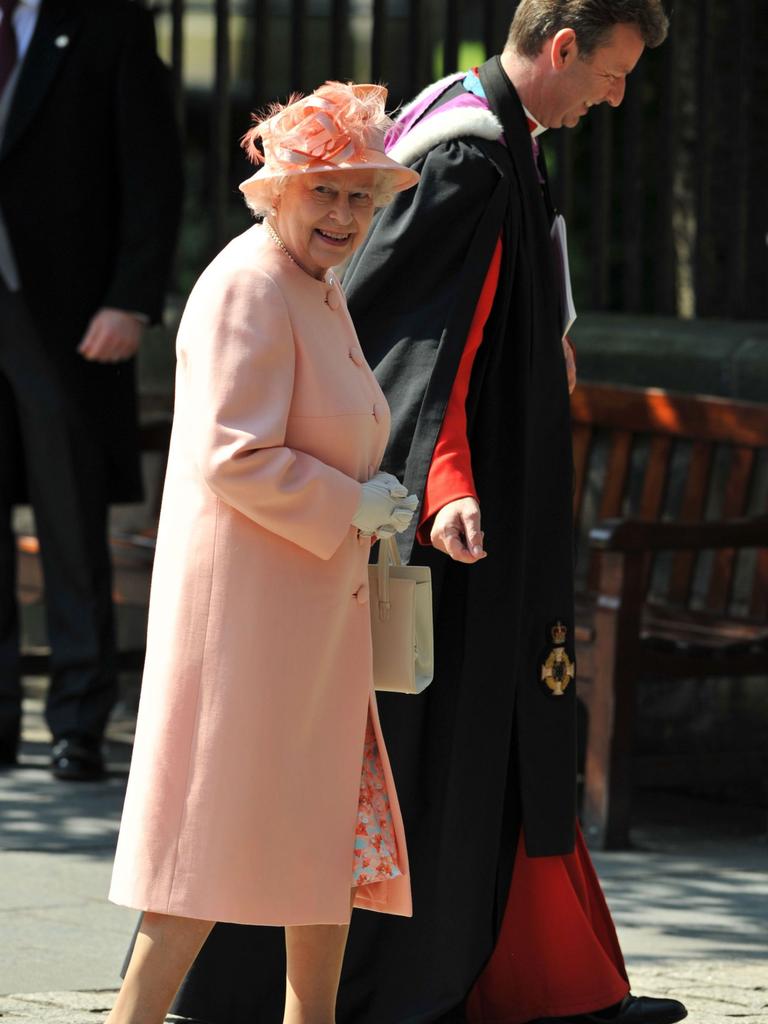 Queen Elizabeth II’s coat and hat complement her dress choice.