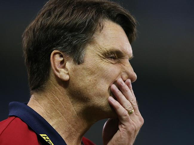 MELBOURNE, AUSTRALIA - AUGUST 30: Demons coach Paul Roos walks off after defeat during the round 23 AFL match between the North Melbourne Kangaroos and the Melbourne Demons at Etihad Stadium on August 30, 2014 in Melbourne, Australia. (Photo by Michael Dodge/Getty Images)