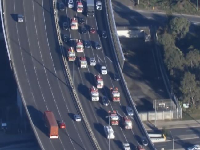 A convoy of CFA trucks makes its way to Victoria's parliament. Picture: 9News