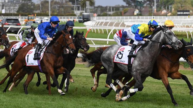 Jockey Pat Cosgrave and Best Solution (third from left) sit just off the speed down the home straight on the first occasion.