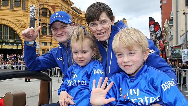 Craig Williams with his children and James Ferguson at the Melbourne Cup parade. Picture: Ian Currie