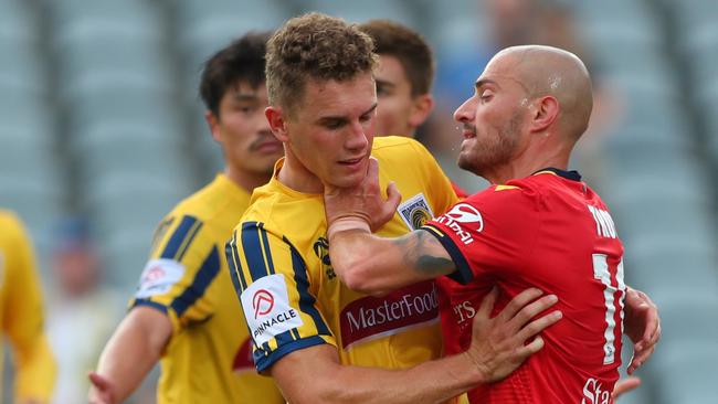 James Troisi of Adelaide United and Gianni Stensness of the Central Coast Marinersclash. Picture: Tony Feder/Getty Images