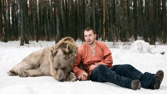 Yuriy Panteleenko with the bear. Pic: Olga Barantseva/ Caters News