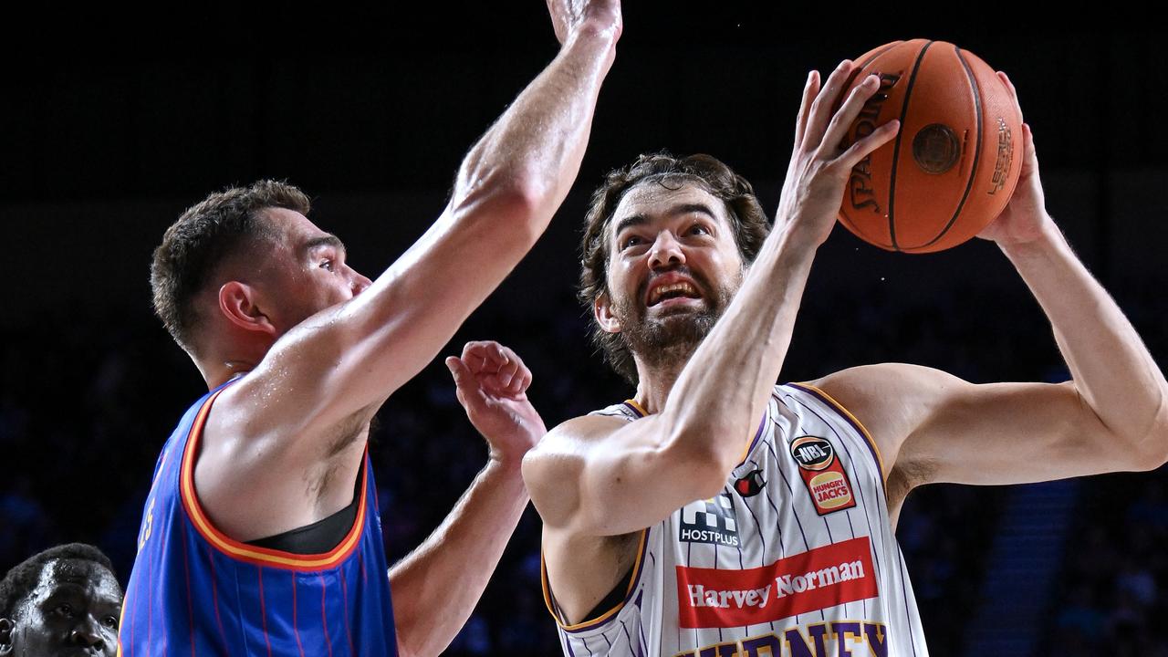 ADELAIDE, AUSTRALIA - FEBRUARY 02: Jordan Hunter of the Kings heads for the basket defended by Issac Humphries of the 36ers during the round 18 NBL match between Adelaide 36ers and Sydney Kings at Adelaide Entertainment Centre, on February 02, 2024, in Adelaide, Australia. (Photo by Mark Brake/Getty Images)