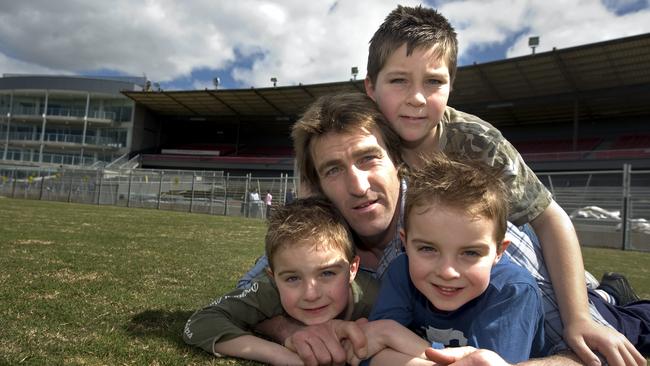 Scott West with his boys, Rhylee, Cooper and Kobi after announcing his retirement. Picture: Jay Town.