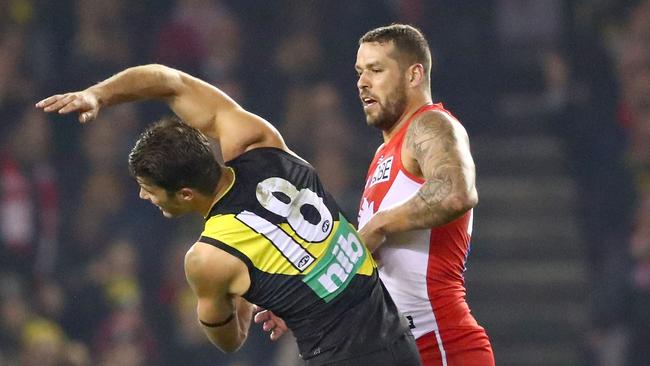 Lance Franklin of the Swans strikes Alex Rance of the Tigers during the round 15 AFL match. Picture: Getty Images